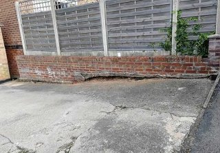A concrete driveway uplifted, groundwork prepared and a bradstone woburn rumbled graphite pavior in three different sizes laid at a job in Carlton, Nottingham