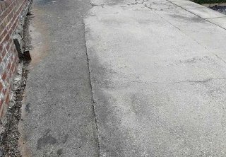 A concrete driveway uplifted, groundwork prepared and a bradstone woburn rumbled graphite pavior in three different sizes laid at a job in Carlton, Nottingham