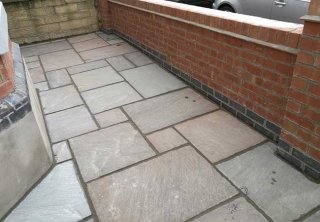 Autumn brown indian sanstone patio we layed behind a front garden wall we built at a job in West Bridgford, Nottingham Autumn brown indian sanstone patio we layed behind a front garden wall we built at a job in West Bridgford, Nottingham