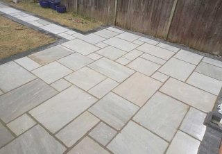 A rear patio we created in Radcliffe on Trent (Nottinghamshire) using a charcoal pavior border with a kandla grey indian sandstone. We also turfed the grassed area. A rear patio we created in Radcliffe on Trent (Nottinghamshire) using a charcoal pavior border with a kandla grey indian sandstone. We also turfed the grassed area.