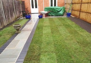 A rear patio we created in Radcliffe on Trent (Nottinghamshire) using a charcoal pavior border with a kandla grey indian sandstone. We also turfed the grassed area. A rear patio we created in Radcliffe on Trent (Nottinghamshire) using a charcoal pavior border with a kandla grey indian sandstone. We also turfed the grassed area.