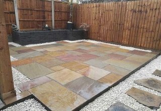 A full rear landscape including fencing, brick planter, multi buff indian sandstone and stone chippings to create this patio in Awsworth, Nottingham. A full rear landscape including fencing, brick planter, multi buff indian sandstone and stone chippings to create this patio in Awsworth, Nottingham.