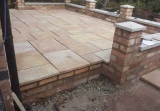A patio we layed in Gedling, Nottingham once we had built the retaining wall, steps and installed the fence A patio we layed in Gedling, Nottingham once we had built the retaining wall, steps and installed the fence