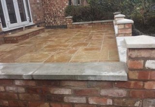 A patio we layed in Gedling, Nottingham once we had built the retaining wall, steps and installed the fence A patio we layed in Gedling, Nottingham once we had built the retaining wall, steps and installed the fence