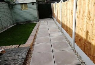 A rear patio path we created using plain concrete slabs, artificail grass and a new fence at a property in Netherfield, Nottingham A rear patio path we created using plain concrete slabs, artificail grass and a new fence at a property in Netherfield, Nottingham