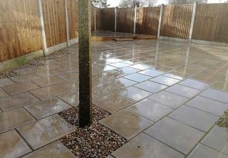A rear patio we installed using plain grey 450x450 slabs for a job in Carlton, Nottingham A rear patio we installed using plain grey 450x450 slabs for a job in Carlton, Nottingham