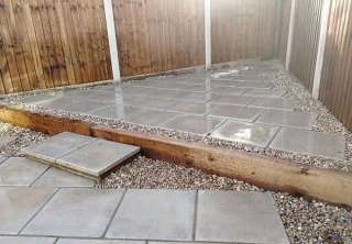 A rear patio we installed using plain grey 450x450 slabs for a job in Carlton, Nottingham A rear patio we installed using plain grey 450x450 slabs for a job in Carlton, Nottingham