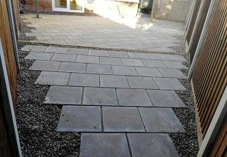 A rear patio we installed using plain grey 450x450 slabs for a job in Carlton, Nottingham A rear patio we installed using plain grey 450x450 slabs for a job in Carlton, Nottingham